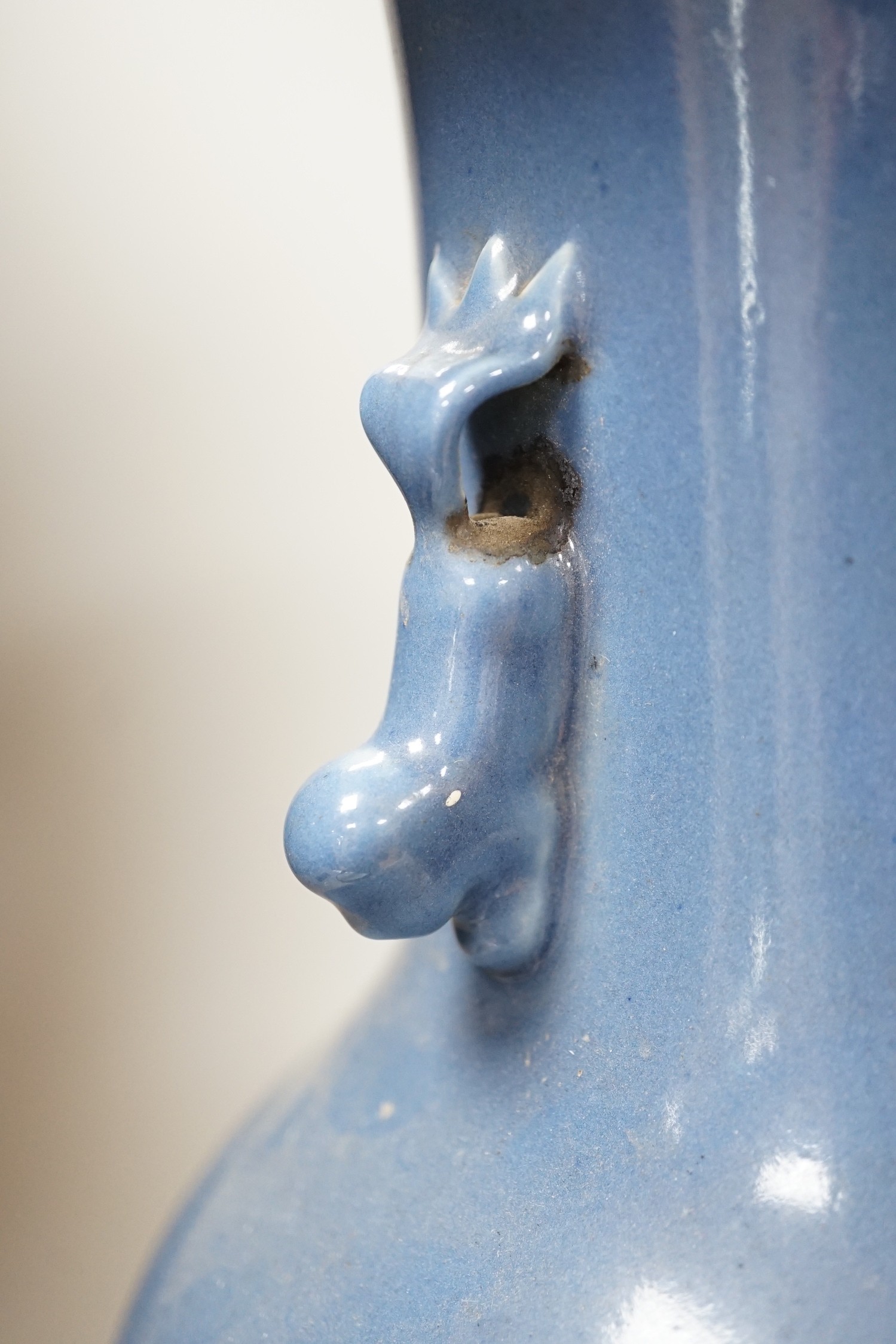 A Chinese slip-decorated blue glazed vase, 40cm